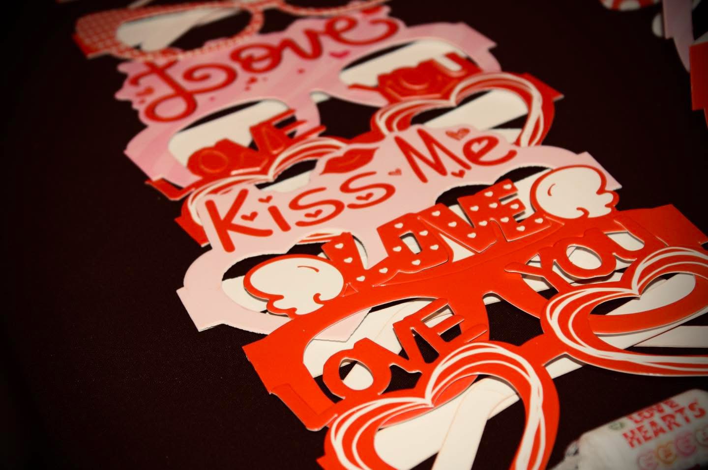 Love and Kiss Me Valentine's props on the table