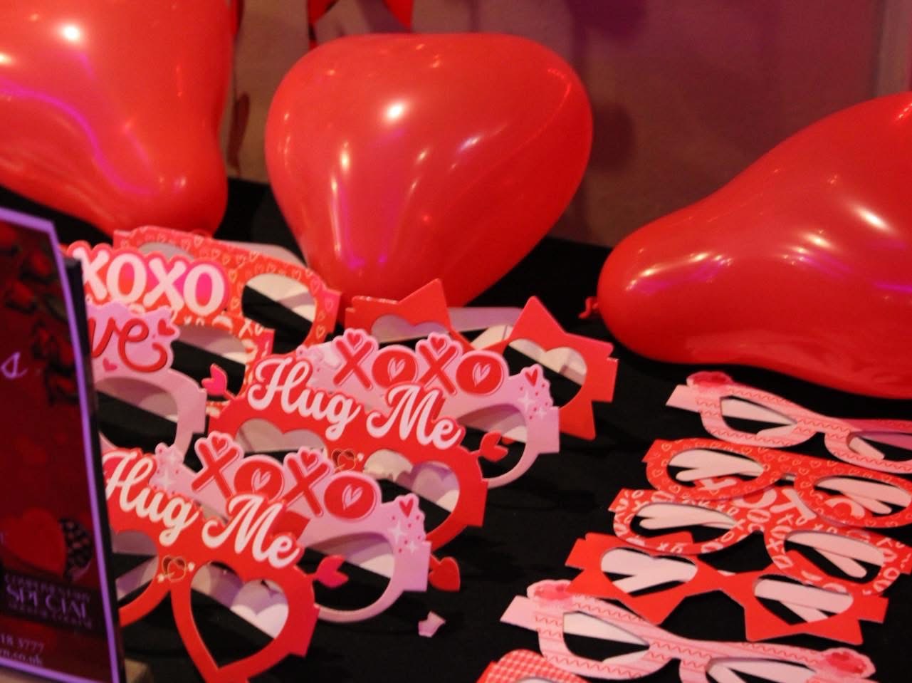 Red heart balloons and Valentine's decorations at Fusion Spice