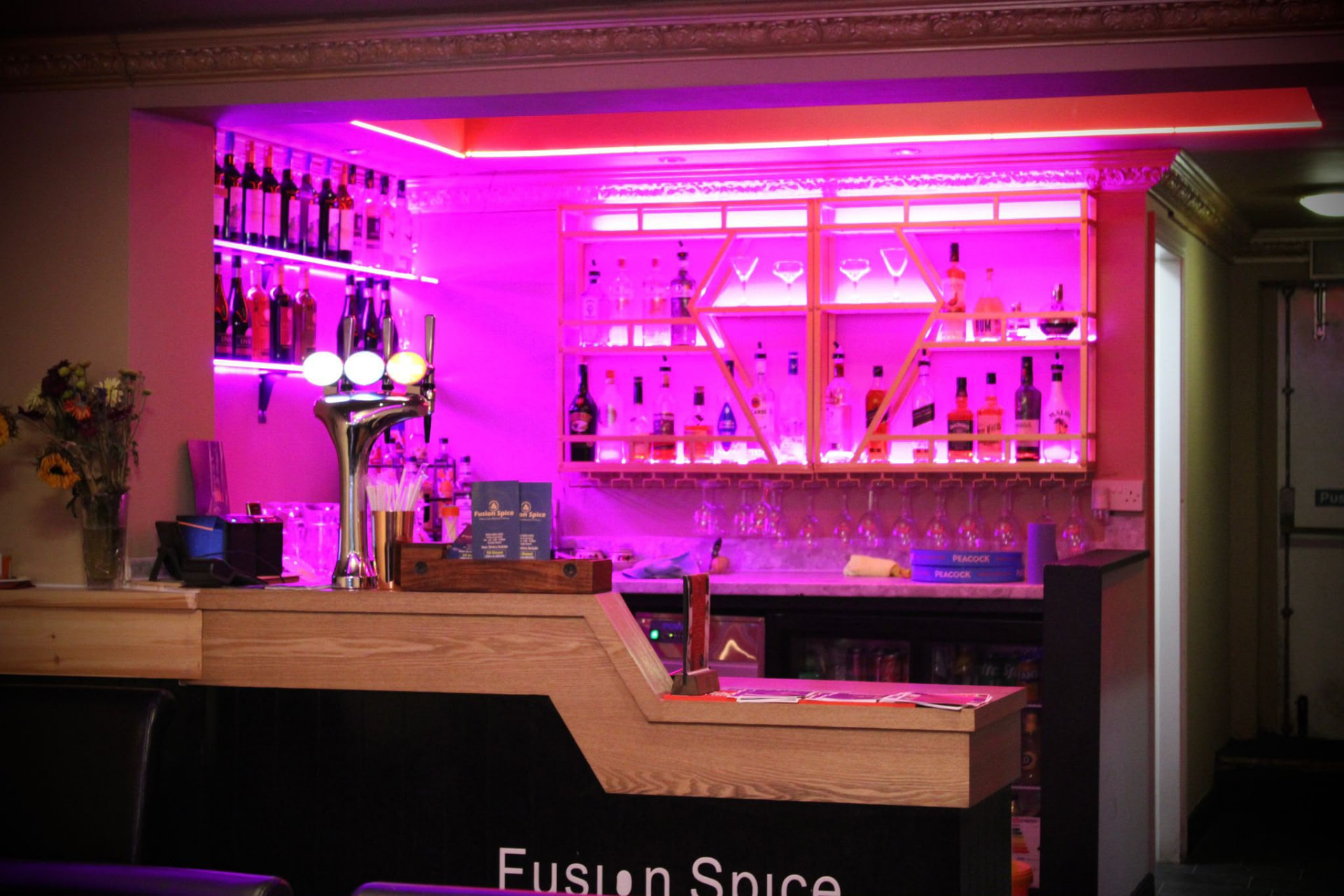 The Fusion Spice cocktail bar with backlit spirit shelves