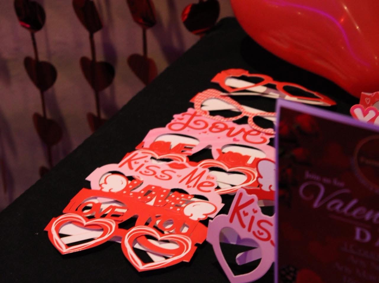 Valentine's Day table dressed with heart garland and decorations