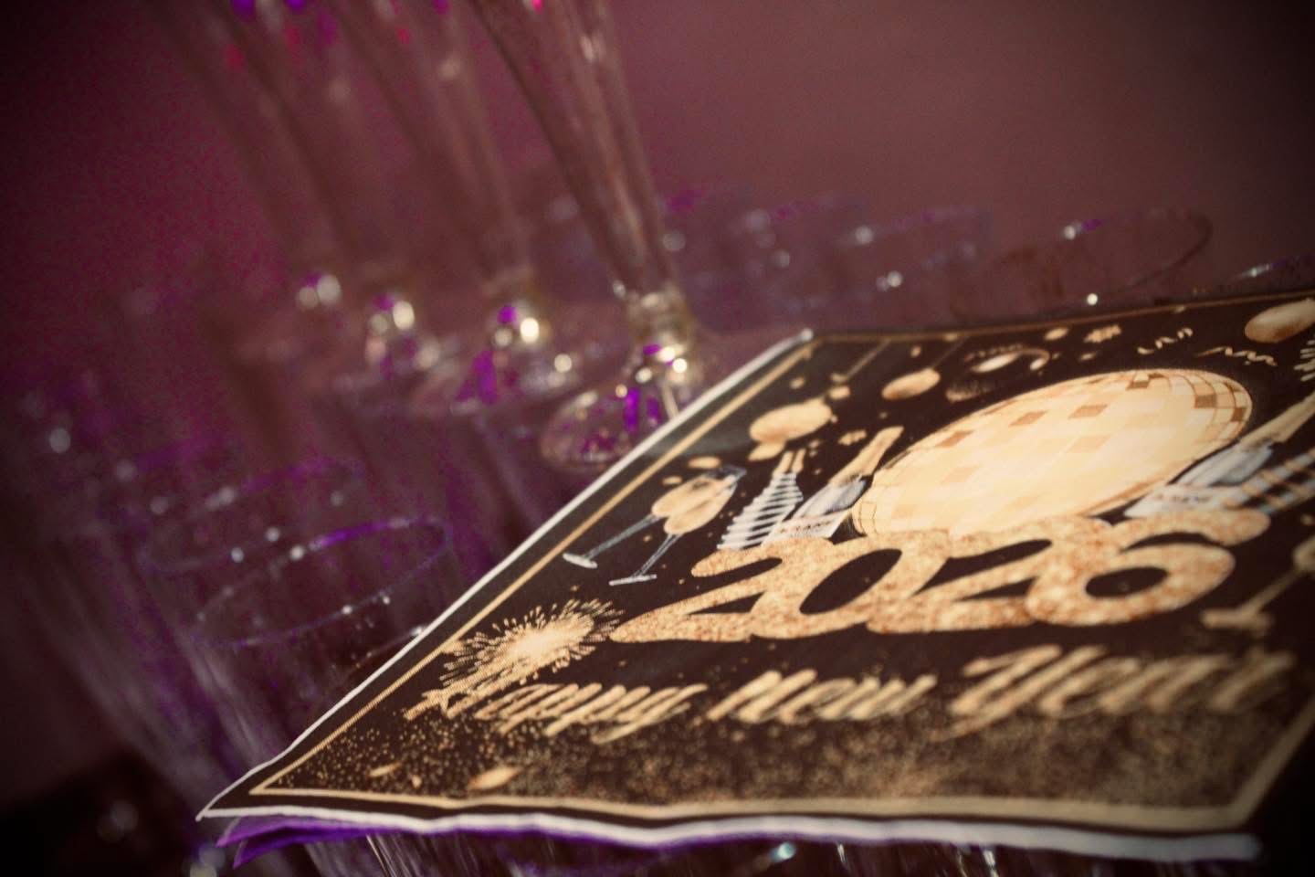 Close-up of gold Happy New Year 2026 napkins