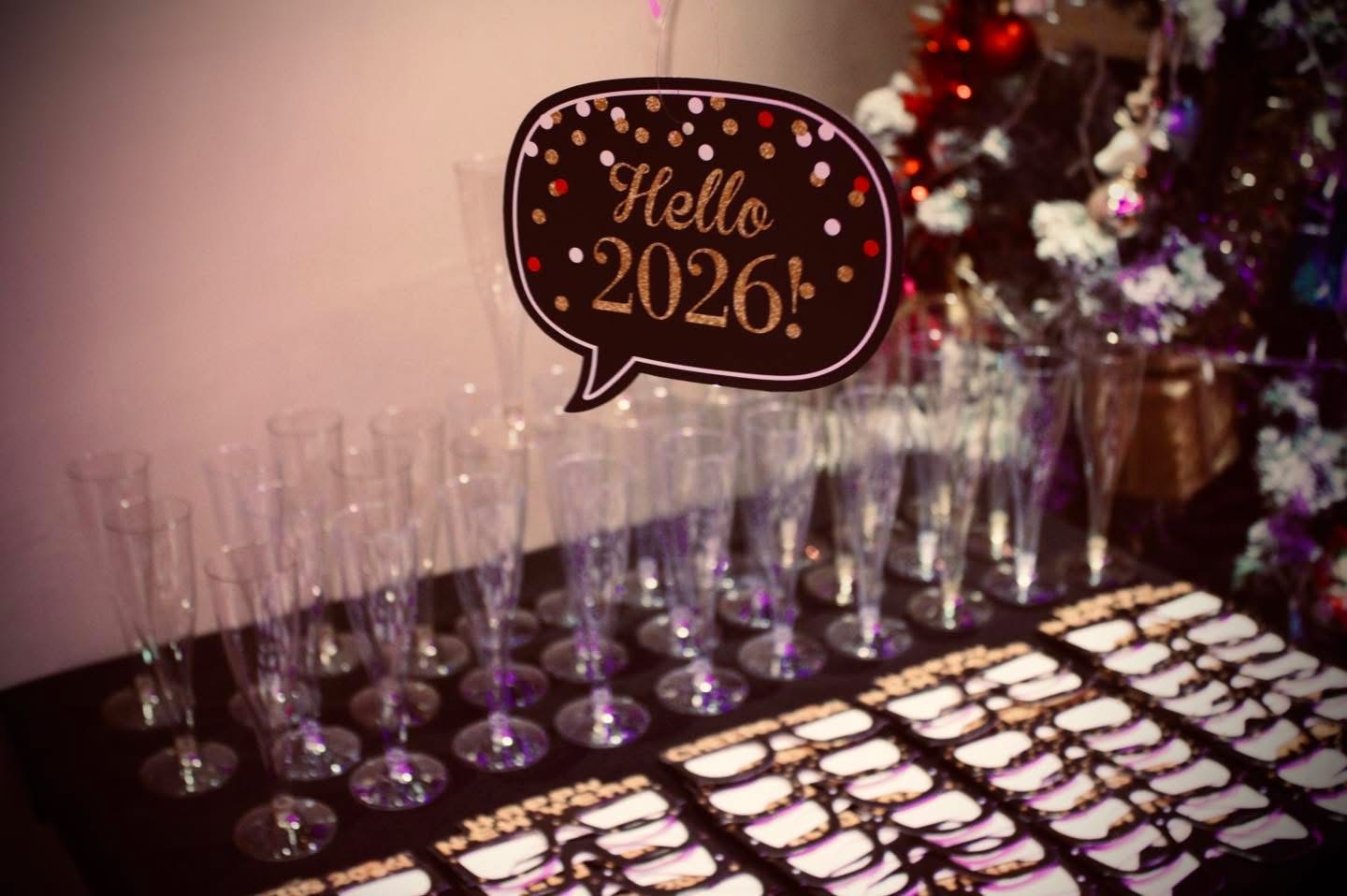 Hello 2026 sign above champagne flutes at Fusion Spice