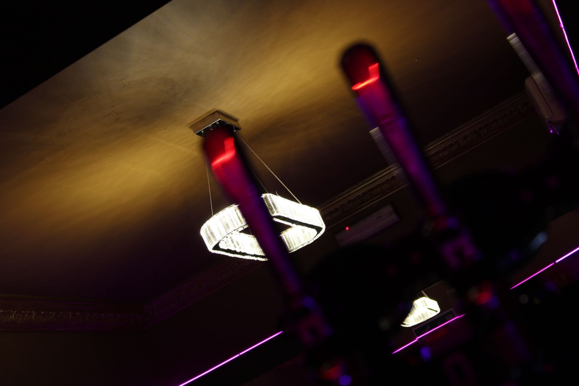 Warm pendant lighting over a table in the restaurant
