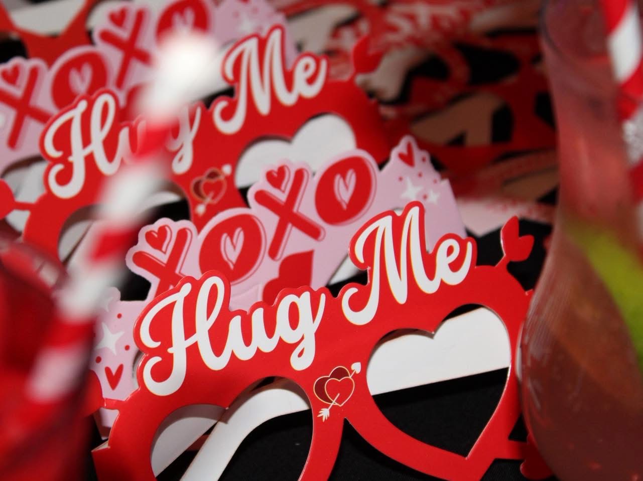 Hug Me and XOXO heart-shaped Valentine's glasses