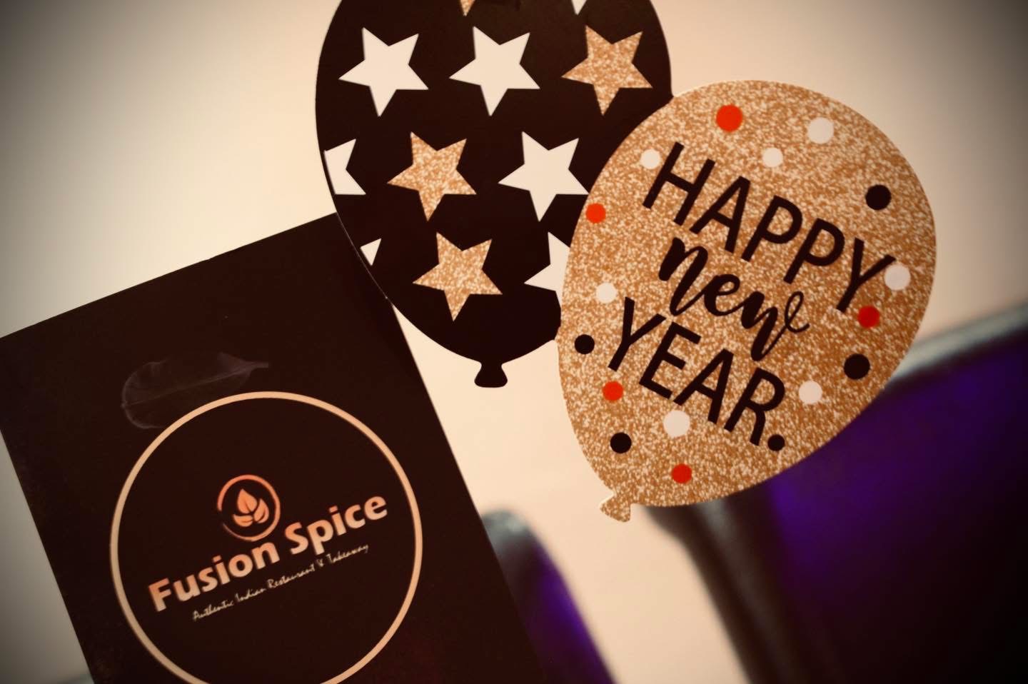 Happy New Year balloon decoration with the Fusion Spice menu