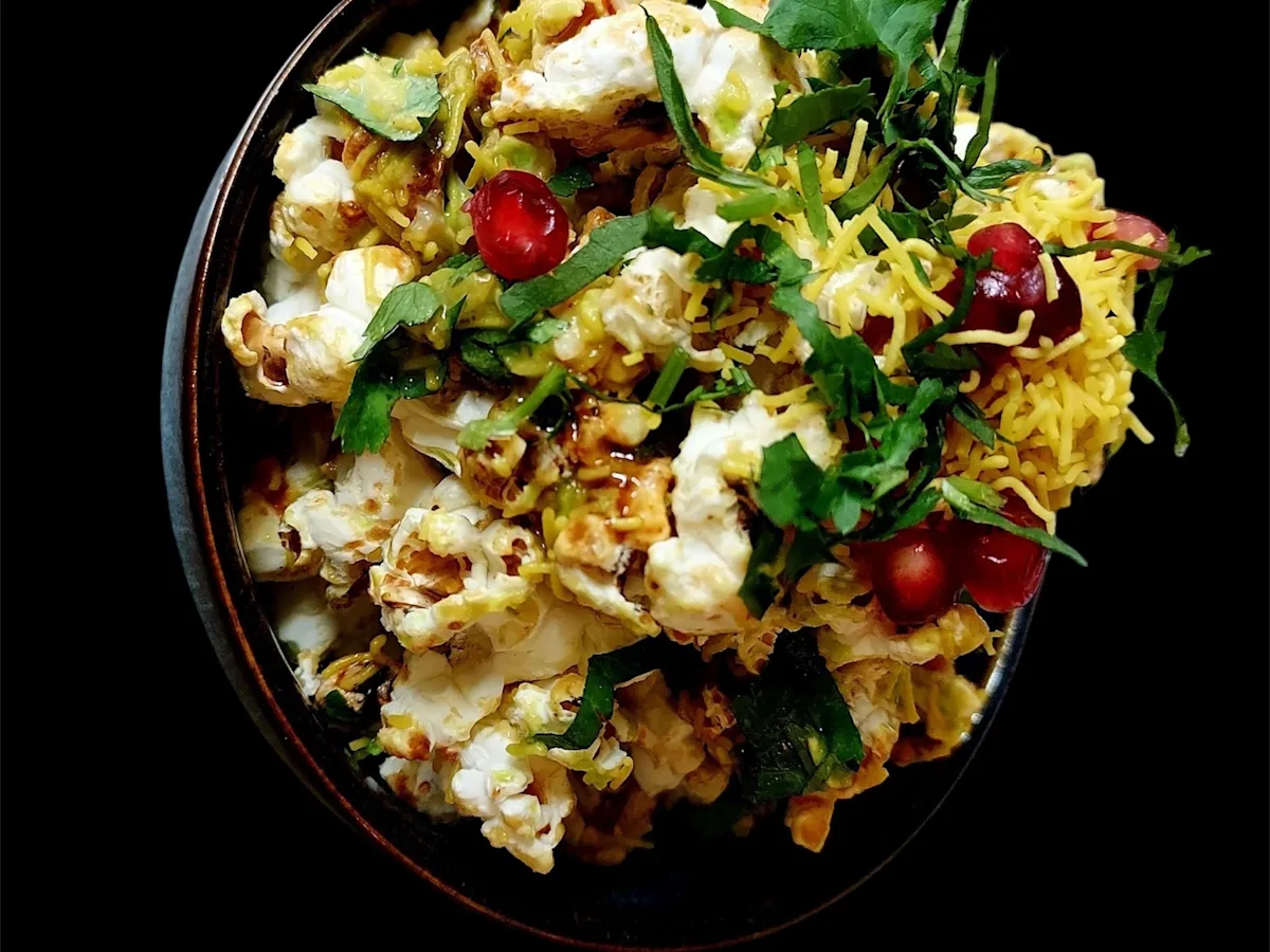 Popcorn chaat with coriander and sev