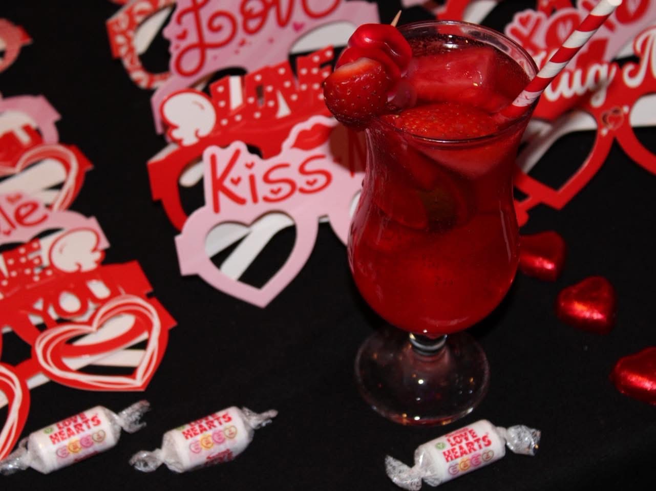 Strawberry Valentine's cocktail with love hearts sweets